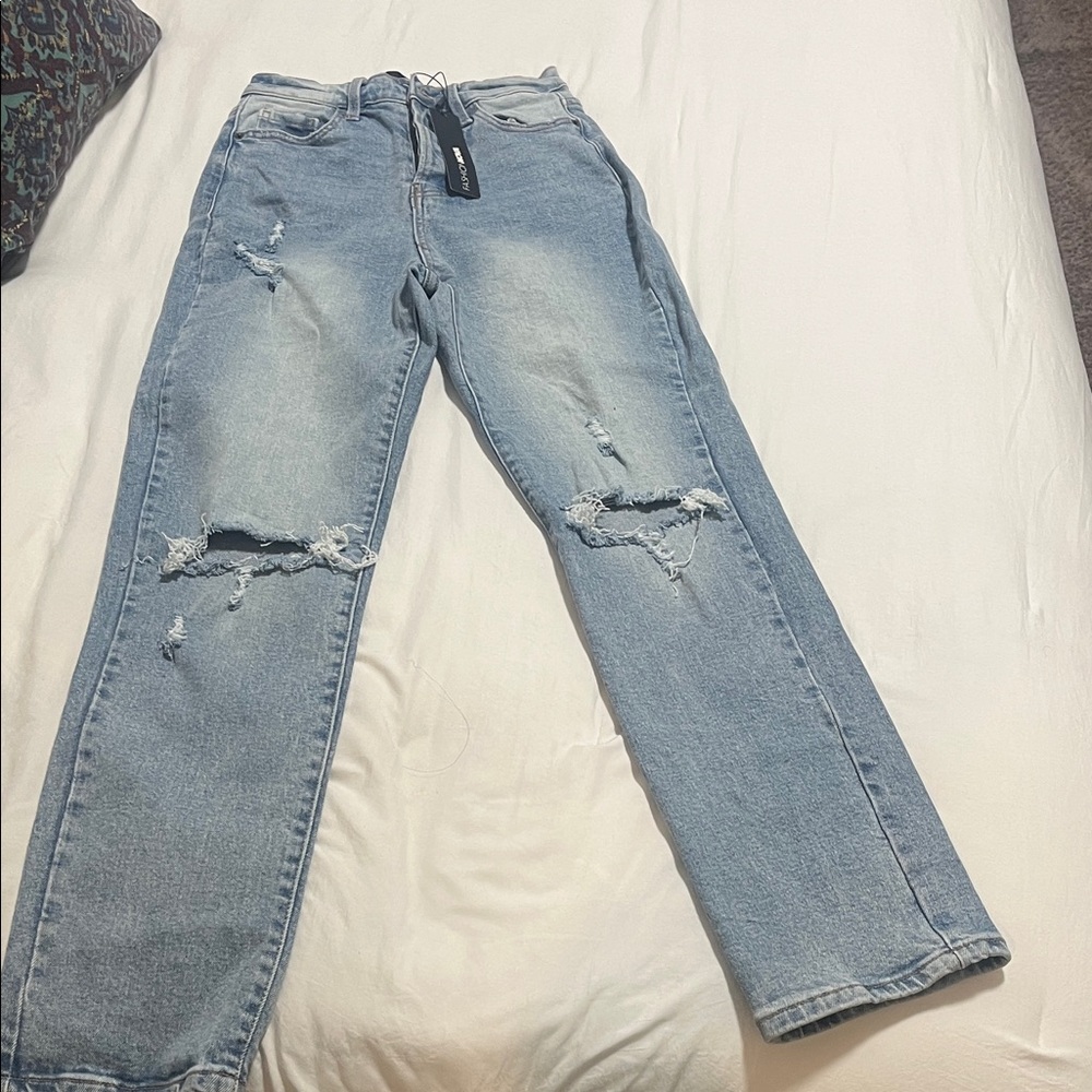 Fashion Nova Straight leg jeans with distressed holes at knees. Size0